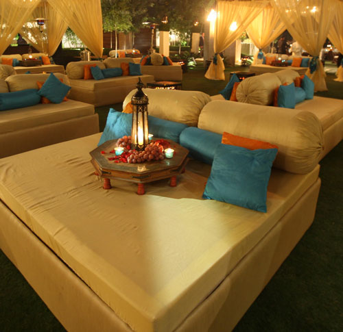 sufi-seating with blue and orange cushions