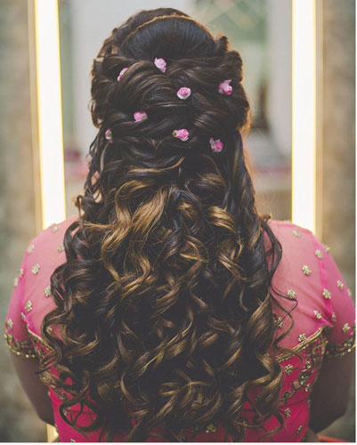 pretty hairstyle with pink fresh flowers - Witty Vows
